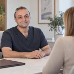 Dr. Armin Akbari in a consultation setting for international rhinoplasty patients